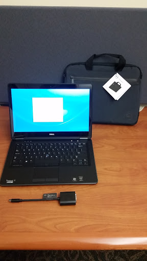 laptop open on desk with case